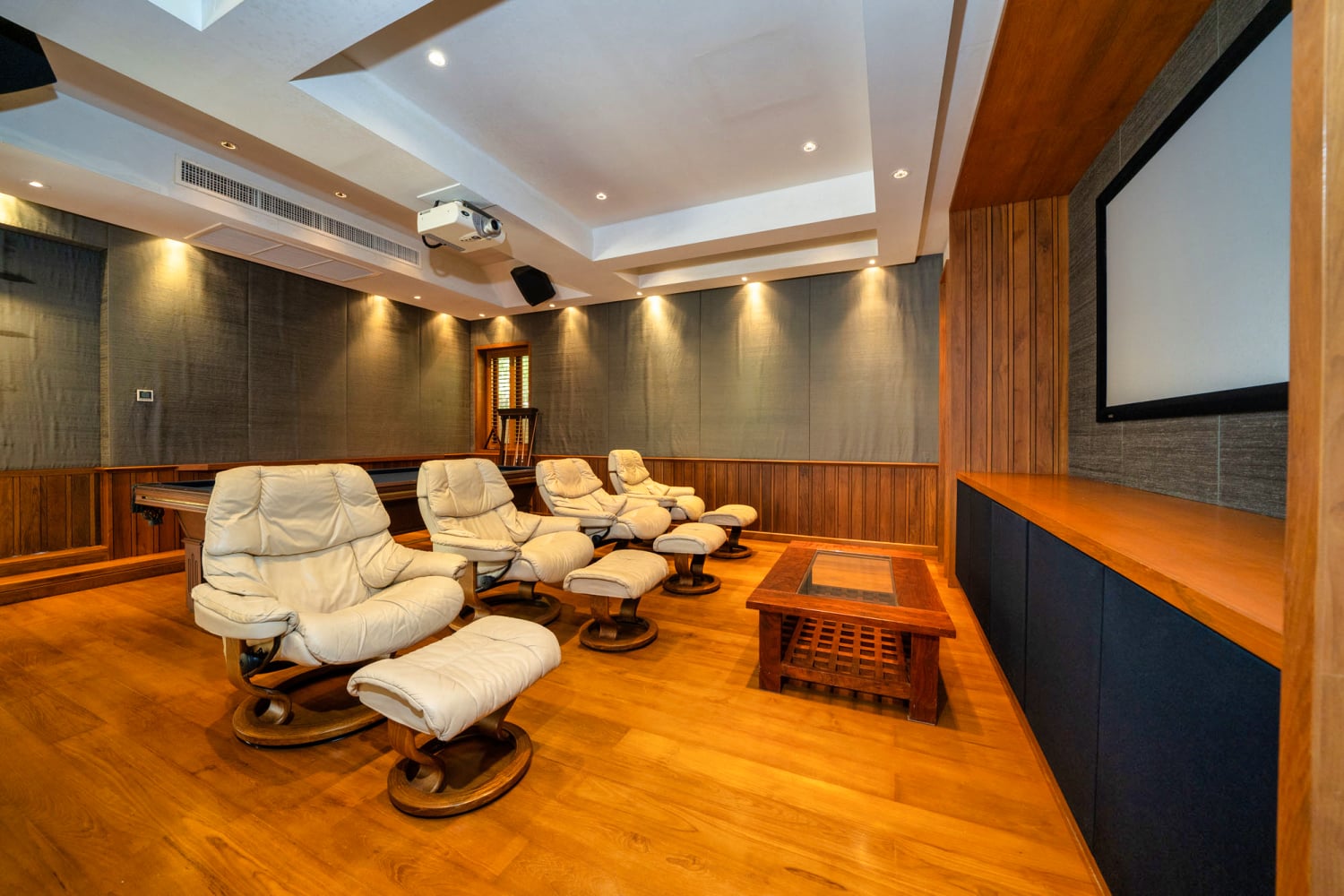 Comfortable reclining lounge chairs in the Villa Apsara entertainment room